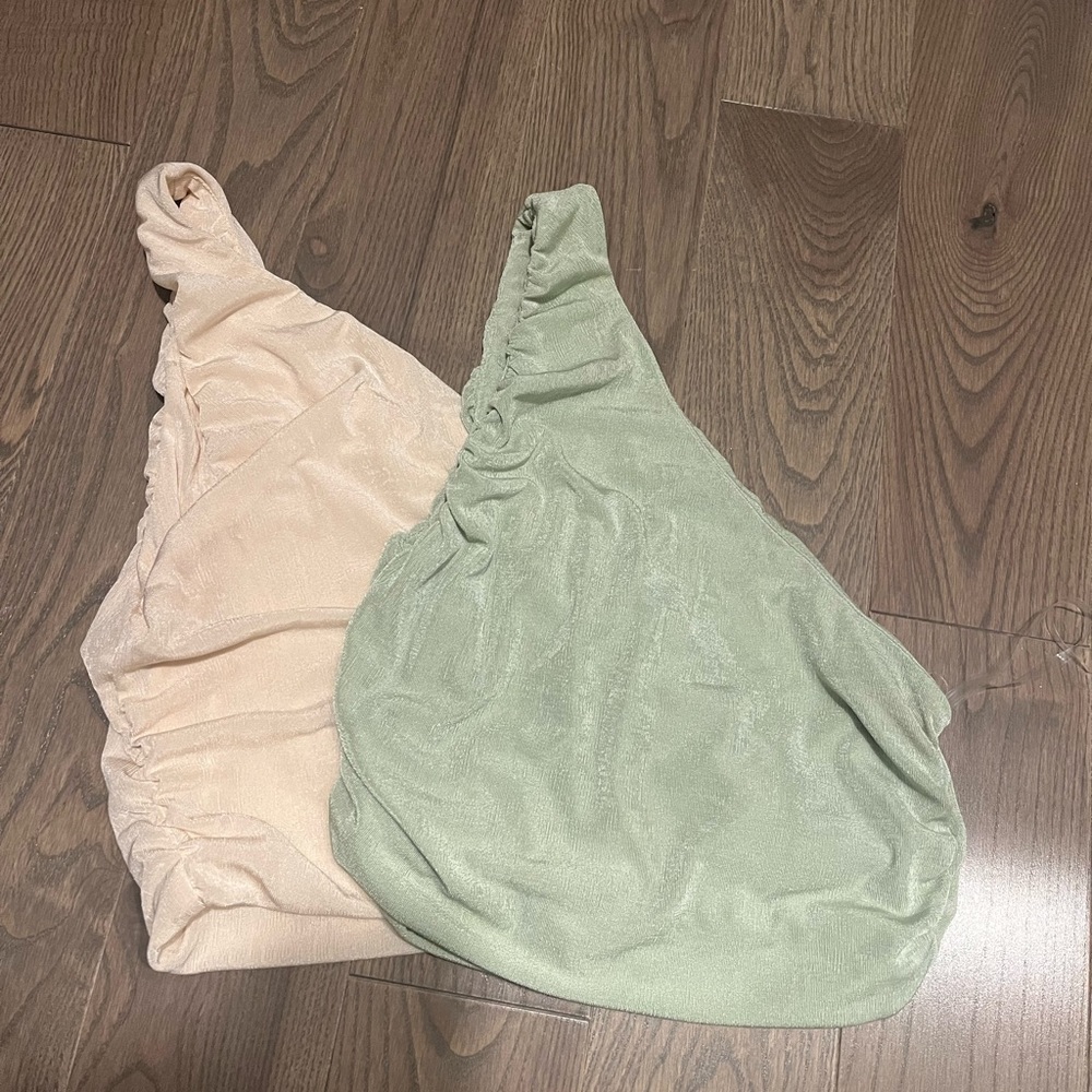 Two one-shoulder crop tops!